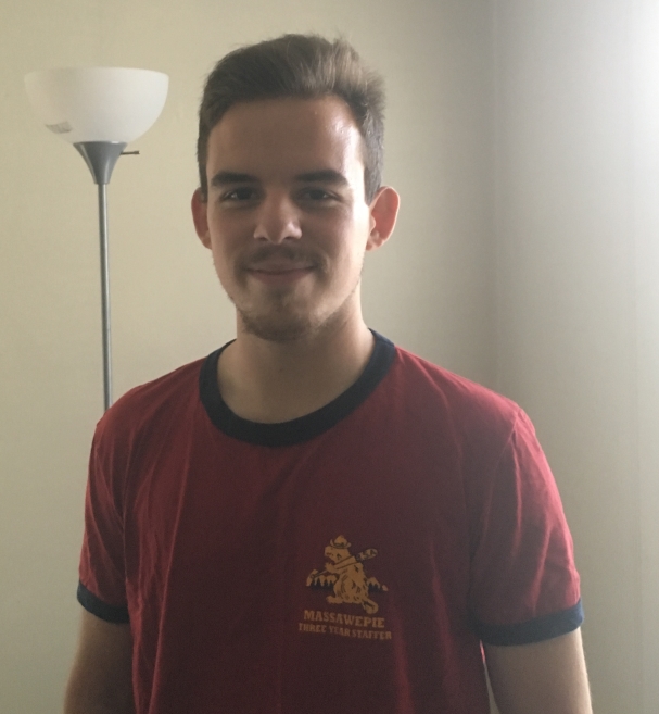 Photo of 2018 Program Director Brendan Flaherty wearing 3-year Staffer Ringer T-shirt